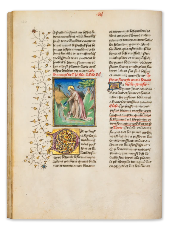 Illuminated page from a medieval manuscript showing the Creation of the birds and fish, with God gesturing toward animals emerging in land and water beneath a blue sky, framed by intricate initials and vine-like marginal ornament