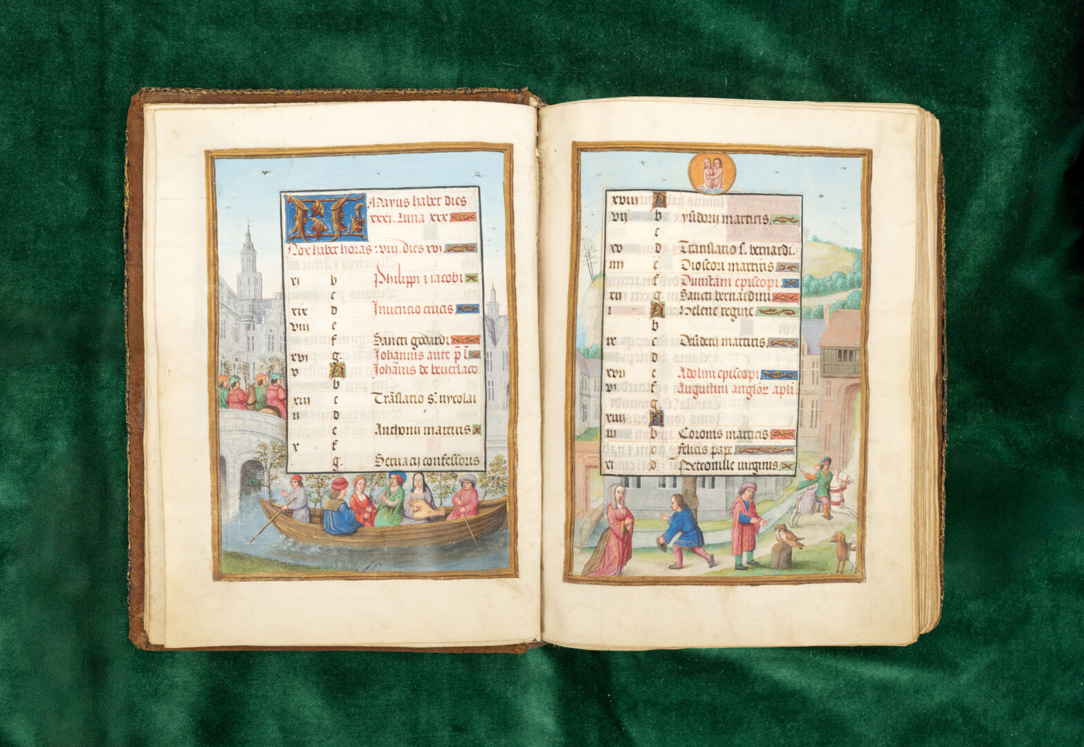 Illuminated calendar pages from a 16th century manuscript depicting activities during the month of May, with a group of people and musicians on a boat enjoying spring.