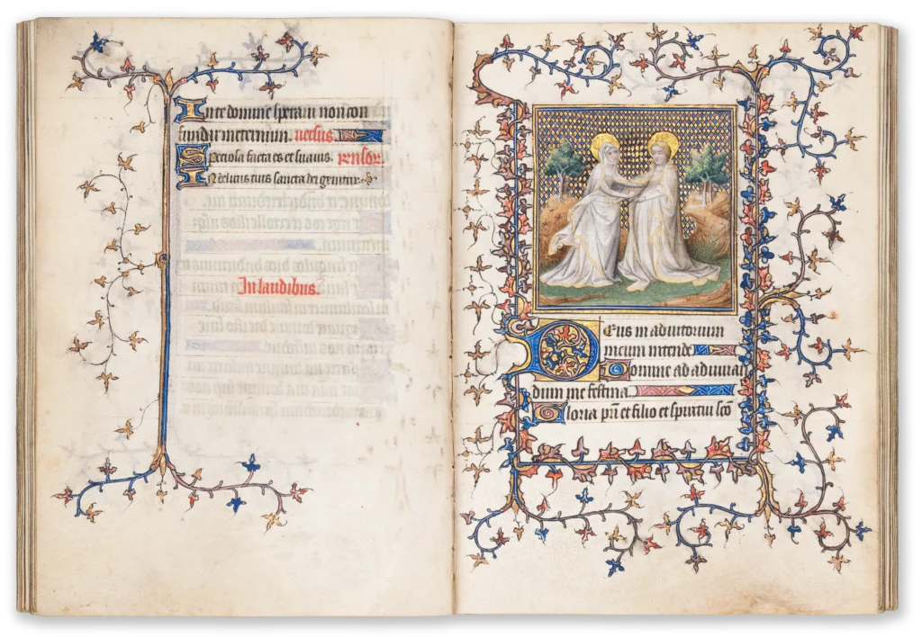 Illuminated medieval manuscript page from the 15th century with a miniature depicting the visitation with the pregnant Virgin Mary and her cousin Elizabeth meeting.