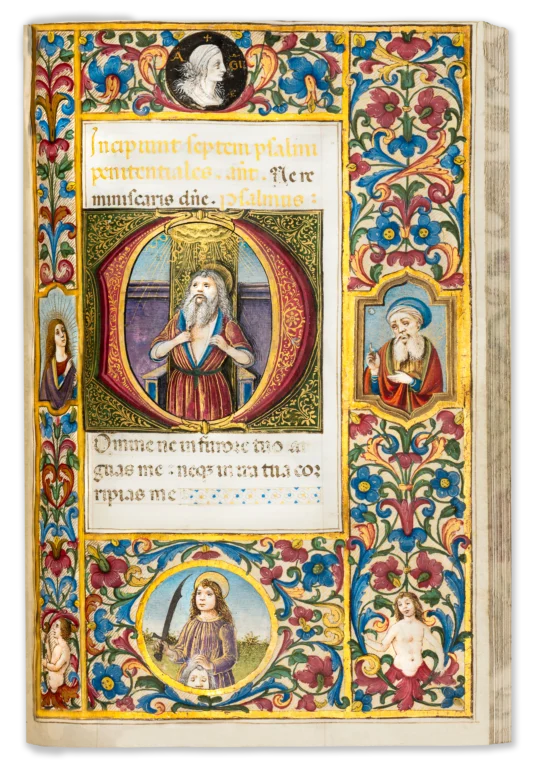 Illuminated renaissance manuscript page from the 16th century containing a miniature of a female saint with a book.